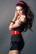 Beautiful  brunette girl posing  on dark background