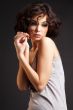 brunette girl posing on dark background