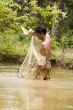 Fishing with throw net