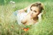 beautiful girl lying down of grass