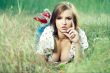 beautiful girl lying down of grass