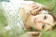 beautiful girl lying down of grass