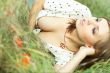 beautiful girl lying down of grass