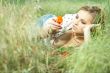 beautiful girl lying down of grass
