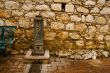 Ancient Brick Wall and Water Pump
