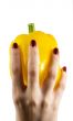 yellow pepper in a womanish hand