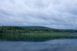 Night summer landscape. Clouds above the river.