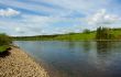 Summer landscape. Clouds above the river.