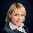 Young smiling woman in a business suit