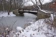 Beautiful Wooden Bridge Over Frozen Stream