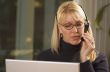 Attractive Businesswoman with Phone Headset