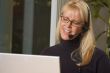 Attractive Businesswoman with Phone Headset