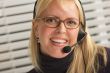 Attractive Businesswoman with Phone Headset