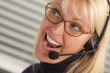 Attractive Businesswoman with Phone Headset
