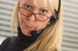 Attractive Businesswoman with Phone Headset