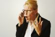 Angry Business Woman on Cell Phone