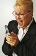 Businesswoman using her cell phone.