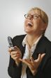 Businesswoman using her cell phone.