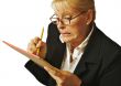 Female Erases Mistake on her Notepad