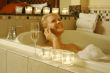 Woman in Bath Using Cell Phone