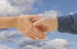Man and woman shaking hands.