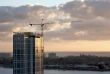 Silhouette of Crane and Building