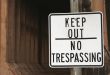 Keep Out Sign and Abandoned Building