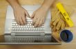 Contractor Reviews Project on Laptop