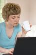 young woman working on a laptop