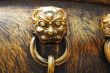 Ancient bronze lions as a handle of vat