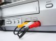 Three electric plugs of different colors