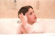 kid in a bathtub with foam