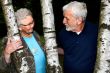 Elderly couple between two trees