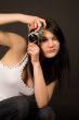 Beautiful fashion girl with camera