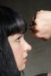 woman clenches fist
