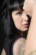 woman with tattoo and fist