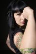 woman with tattoo and fist