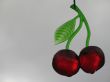 red plastic cherries