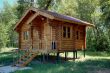 The wooden house with a porch.