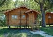 The wooden house with a porch.