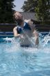 girl jumping out of the water