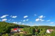 countryside with cottages and forest