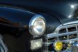 The left headlight of the old automobile