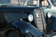Forward part of the old automobile. A cowl and headlights.