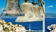 Four big bells against blue sea