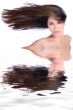 Mixed raced young beauty with hair to one side