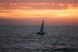 The sea, yacht and clouds on a sunset