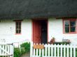 English thatched white cottage