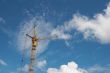 Lifting construction crane at blue sky