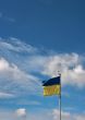 Ukrainian state flag upon blue sky